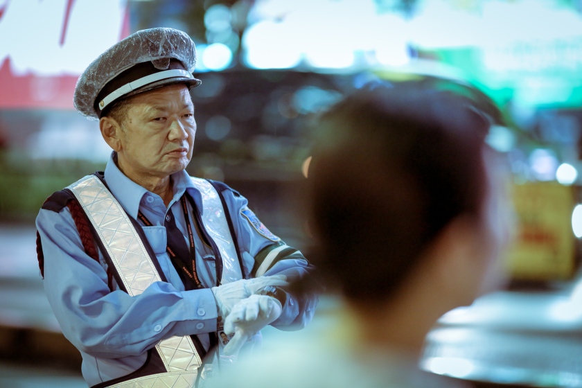 A police officer watching an intersection. Shinjuku, Tokyo. Canon 5D Mark III, 135mm f/2. 